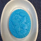 Butterfly among flowers (oval)